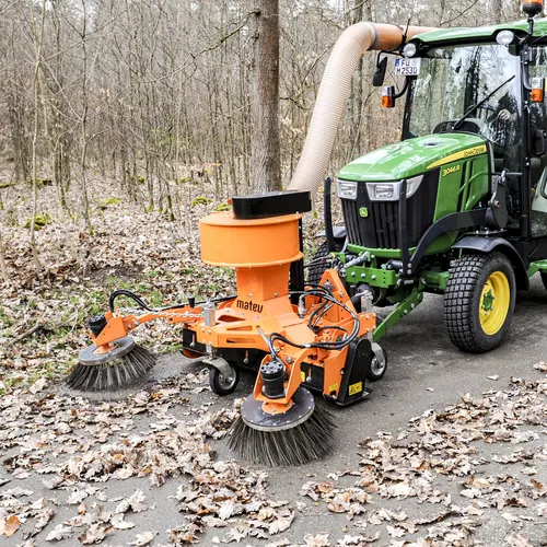 Tractor mounted vacuum nozzle with active suction